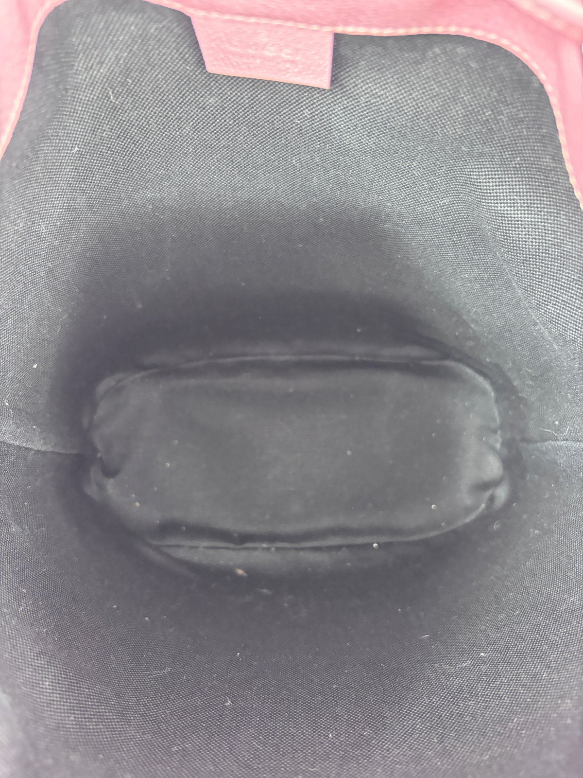 Interior view of the Posh Purse Co. preloved Gucci GG Psychedelic bucket bag featuring a clean black fabric lining.