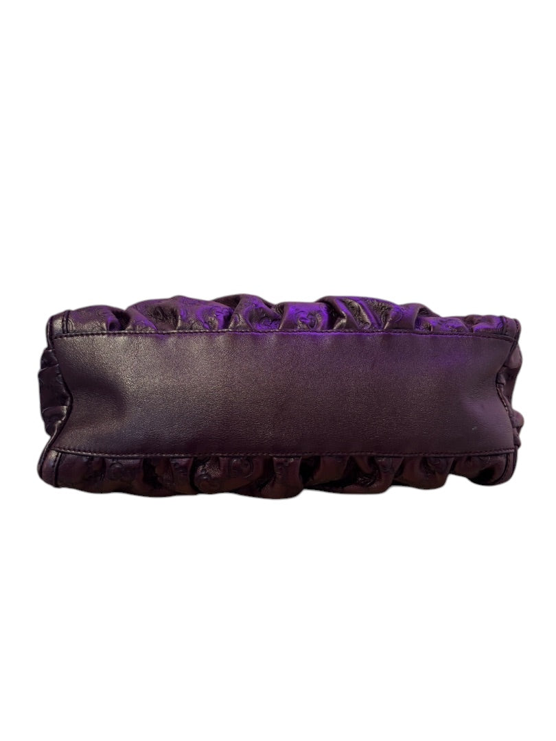 Posh Purse Co. dark purple leather Gucci Guccissima bag with ruched detailing and embossed monogram.