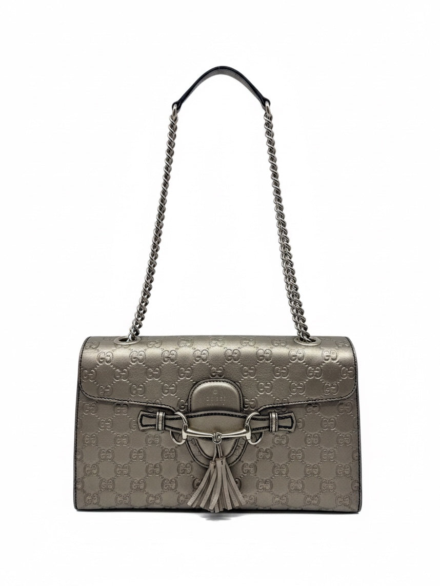 Posh Purse Co. Gucci Guccissima Emily shoulder bag in metallic leather with GG monogram, gold-tone hardware, and tassels.