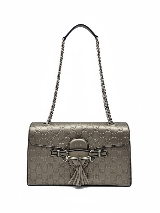Posh Purse Co. Gucci Guccissima Emily shoulder bag in metallic leather with GG monogram, gold-tone hardware, and tassels.