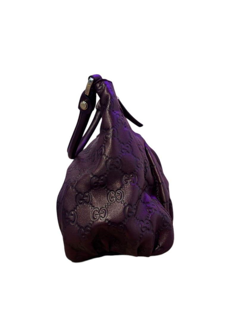 Posh Purse Co. dark purple embossed Guccissima leather hobo bag with single strap.