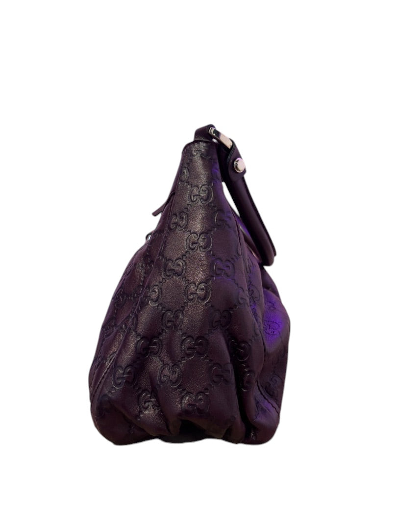 Posh Purse Co. dark purple embossed Guccissima leather hobo bag with single strap.