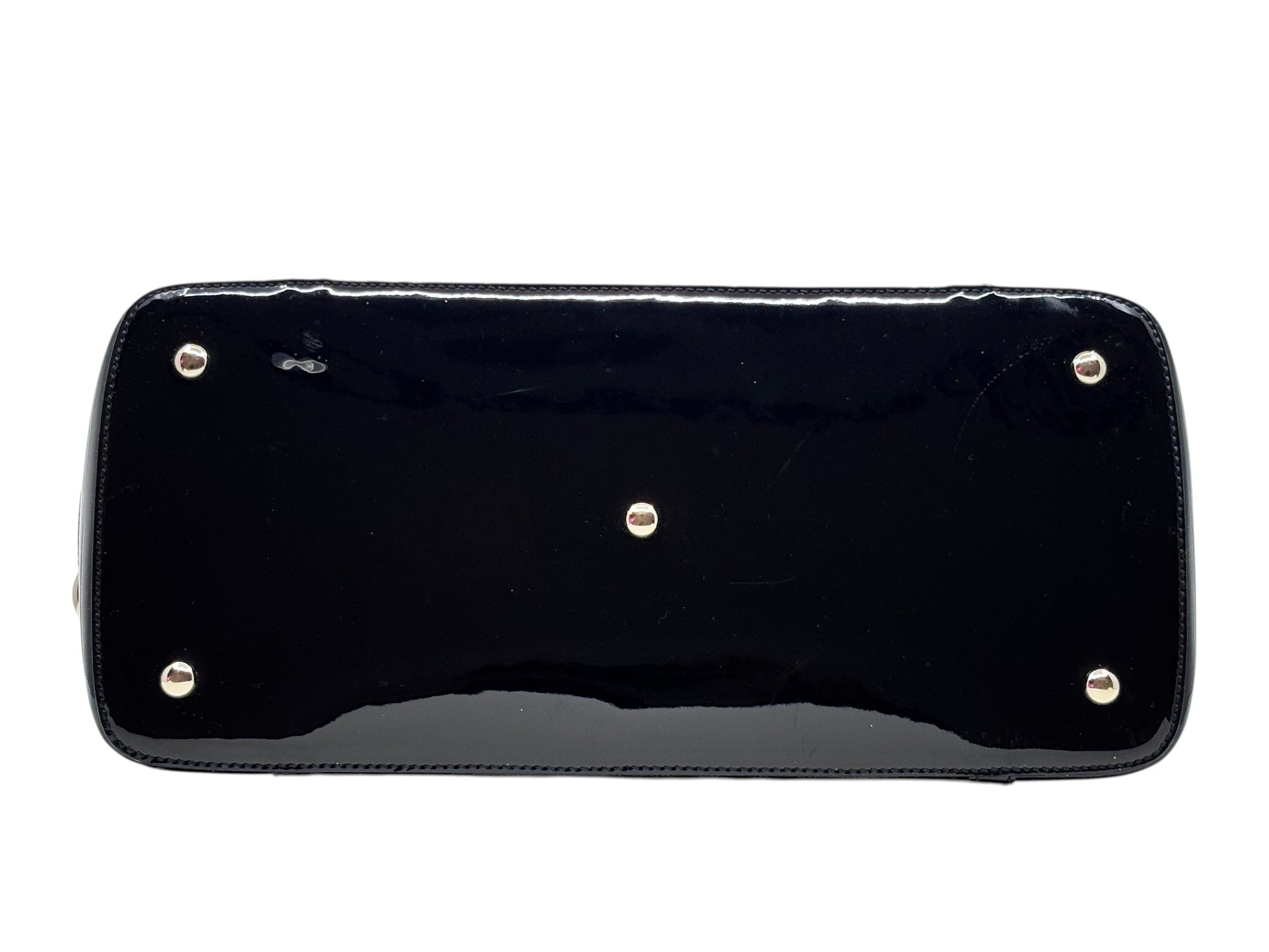 Base view of a black Posh Purse Co Gucci Micro Guccissima handbag showing protective metal feet on the leather bottom