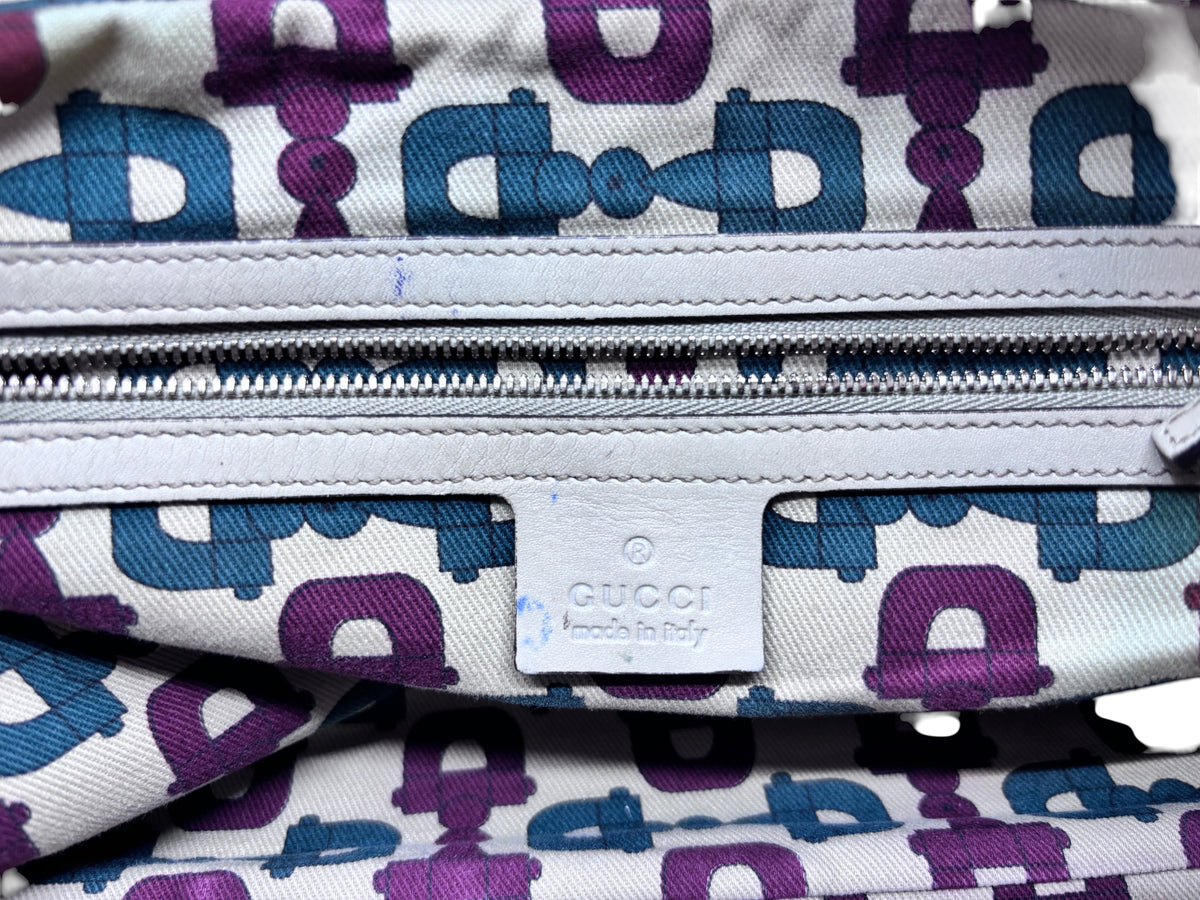 Posh Purse Co preloved Gucci Horsebit Wave bag interior with purple and blue logo lining and leather brand tag