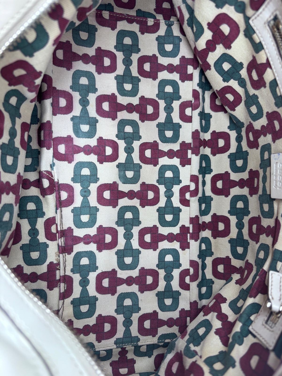 Interior of a Posh Purse Co preloved Gucci Horsebit Wave bag featuring a signature monogram fabric lining.