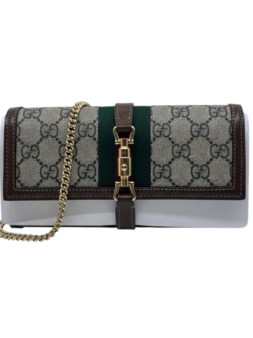 Posh Purse Co Gucci Jackie 1961 clutch in GG Supreme canvas with green stripe, brown leather trim, and gold chain.