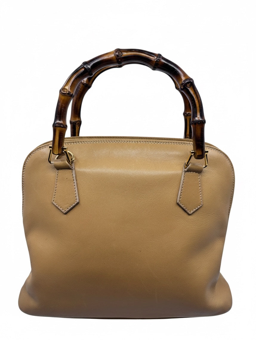 Posh Purse Co preloved Gucci leather satchel handbag featuring an iconic bamboo handle and structured silhouette.