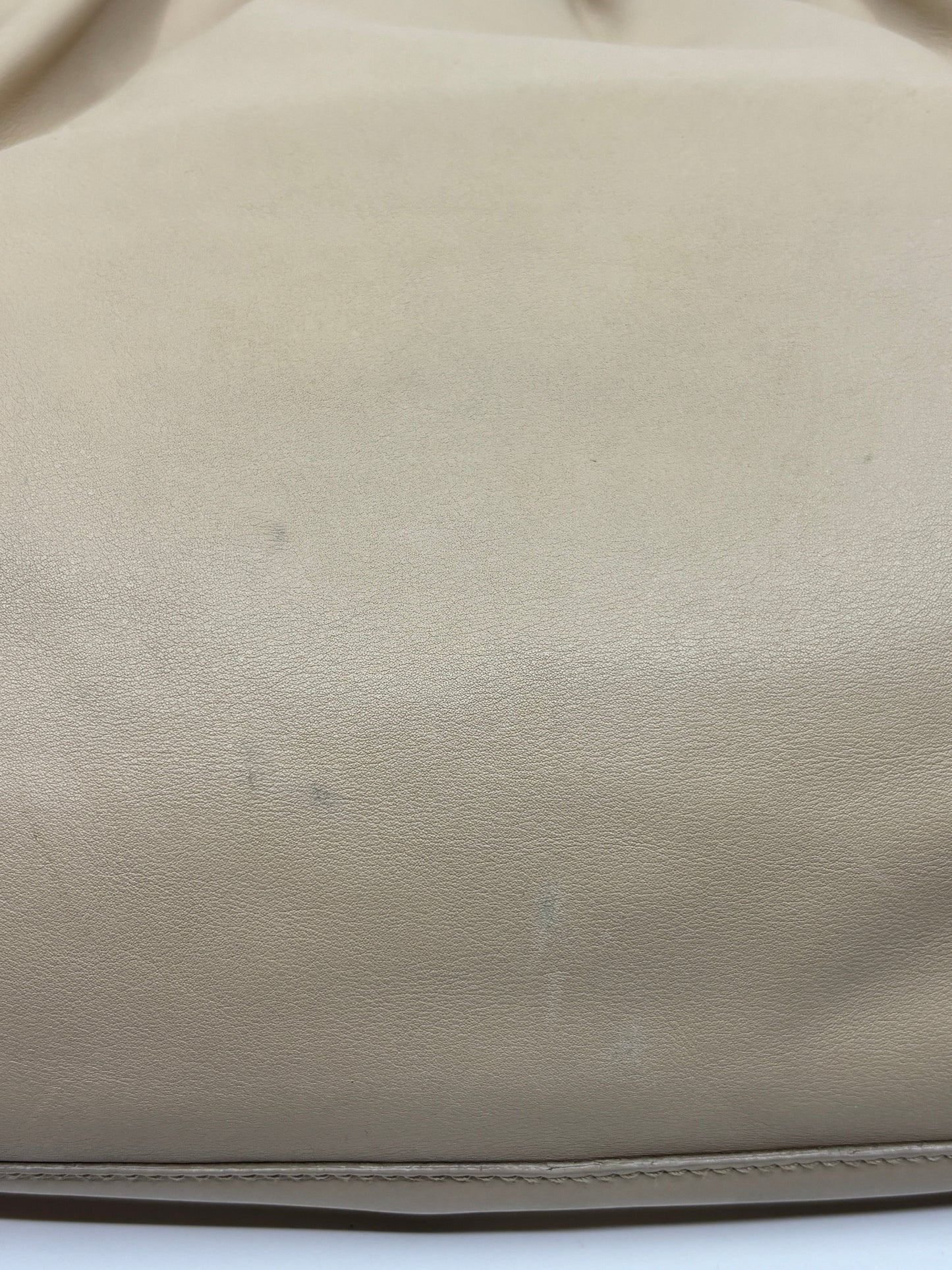 Close-up of beige leather texture on a Posh Purse Co Gucci Tom Ford hobo bag showing minor surface marks.