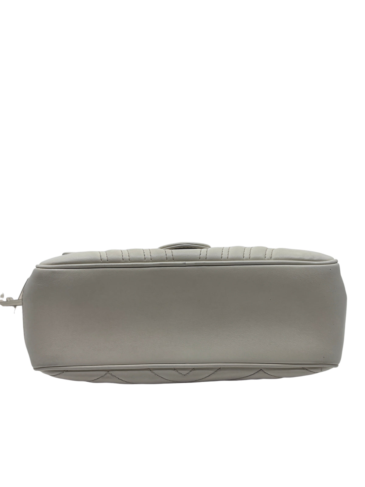 Posh Purse Co Gucci GG Marmont bag base showing smooth off-white leather and matelassé quilting details