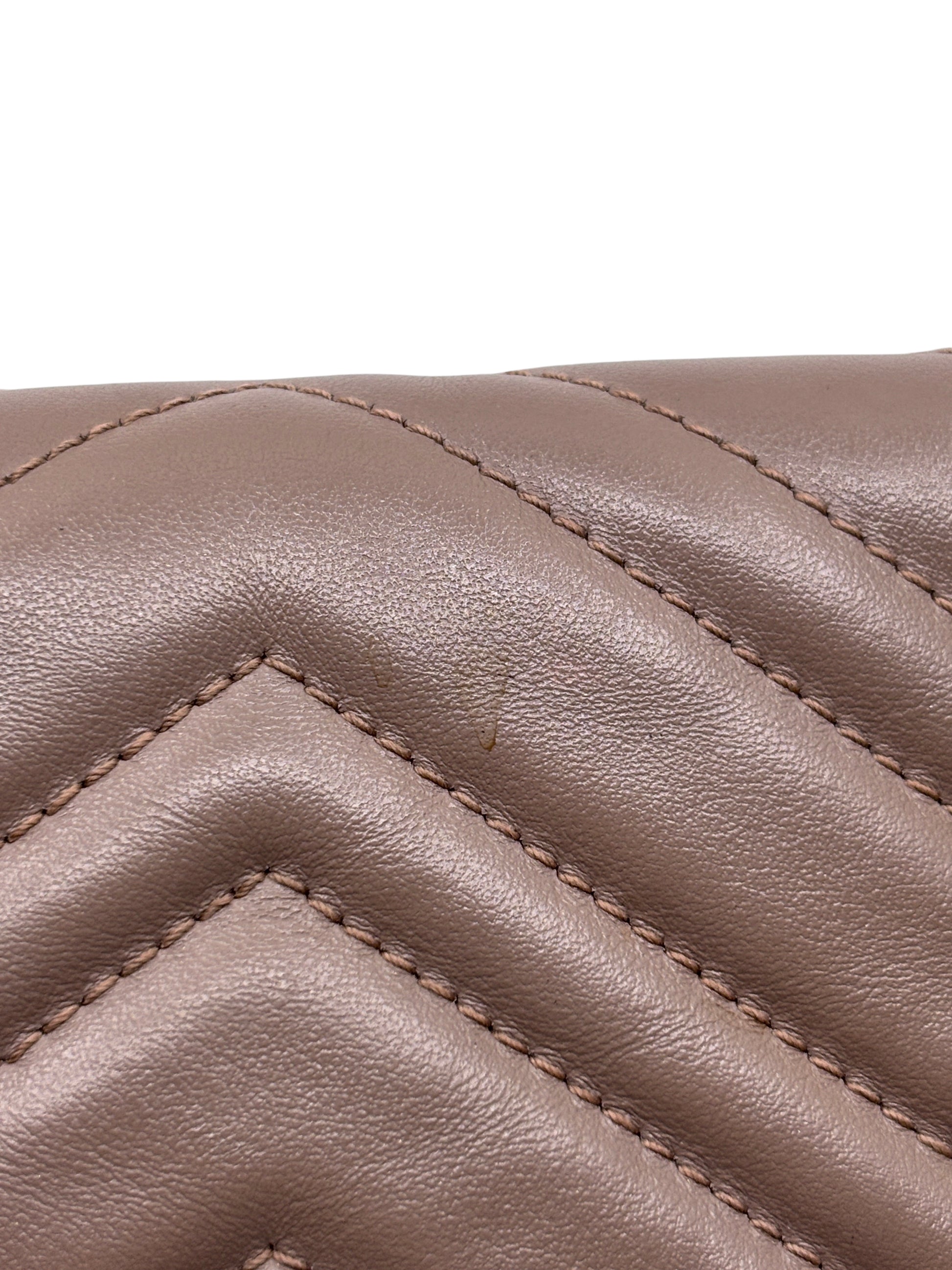 Posh Purse Co beige quilted leather Gucci Marmont bag showing chevron stitching and minor surface wear