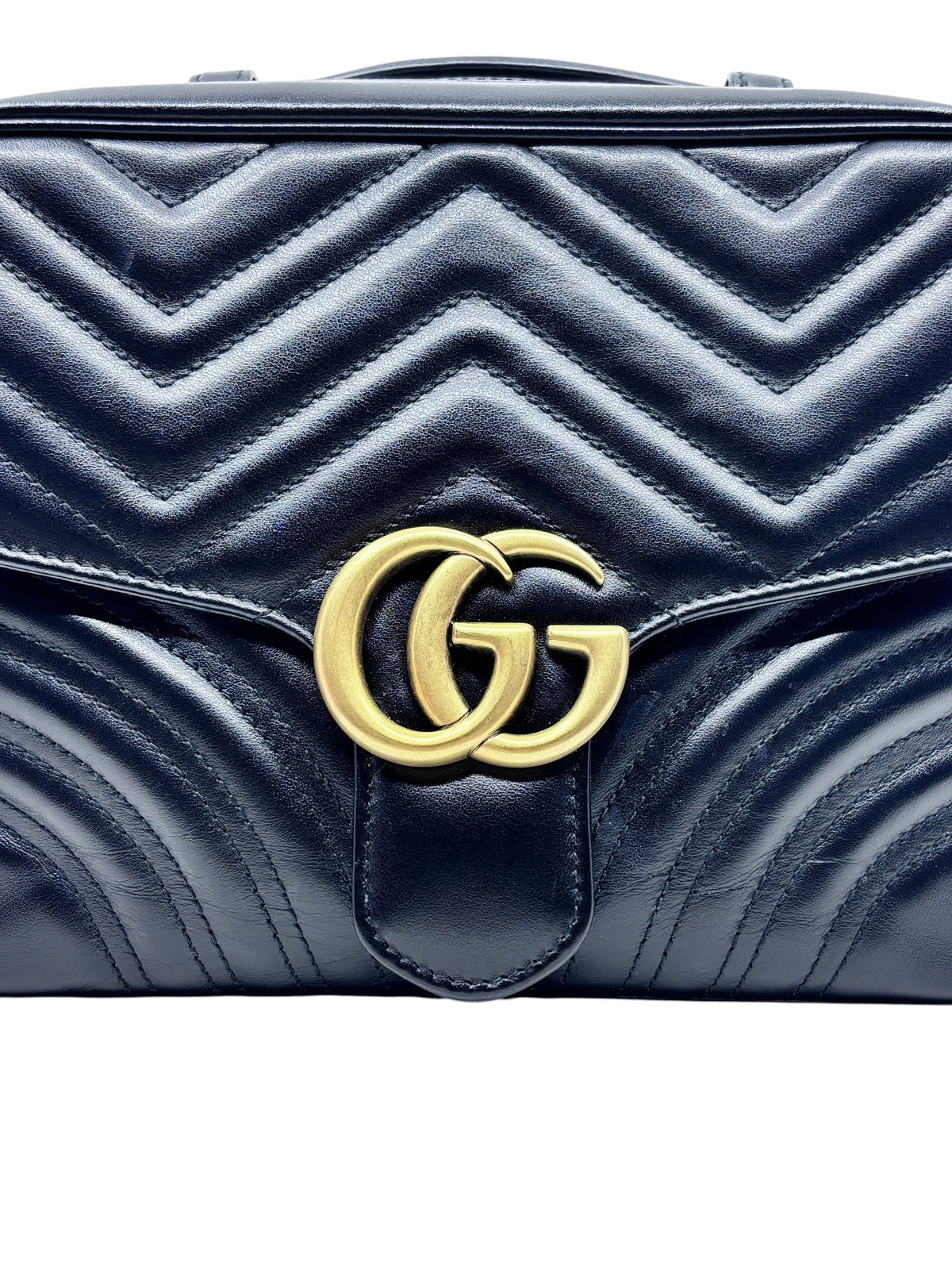 Posh Purse Co black leather Gucci Marmont bag with signature chevron quilting and gold GG logo hardware