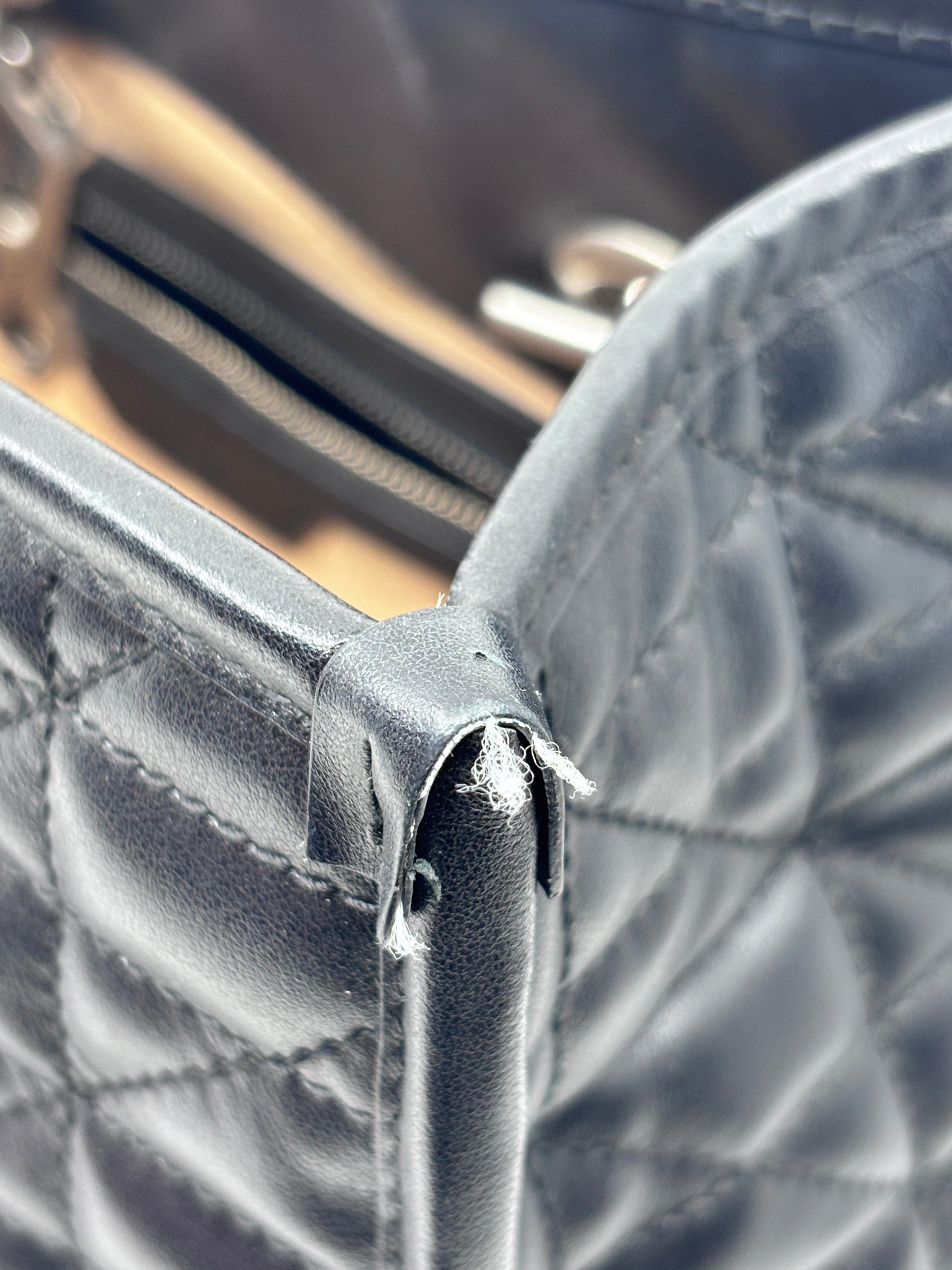 Posh Purse Co Gucci GG Marmont bag corner showing leather wear and fraying on the black matelassé chevron leather