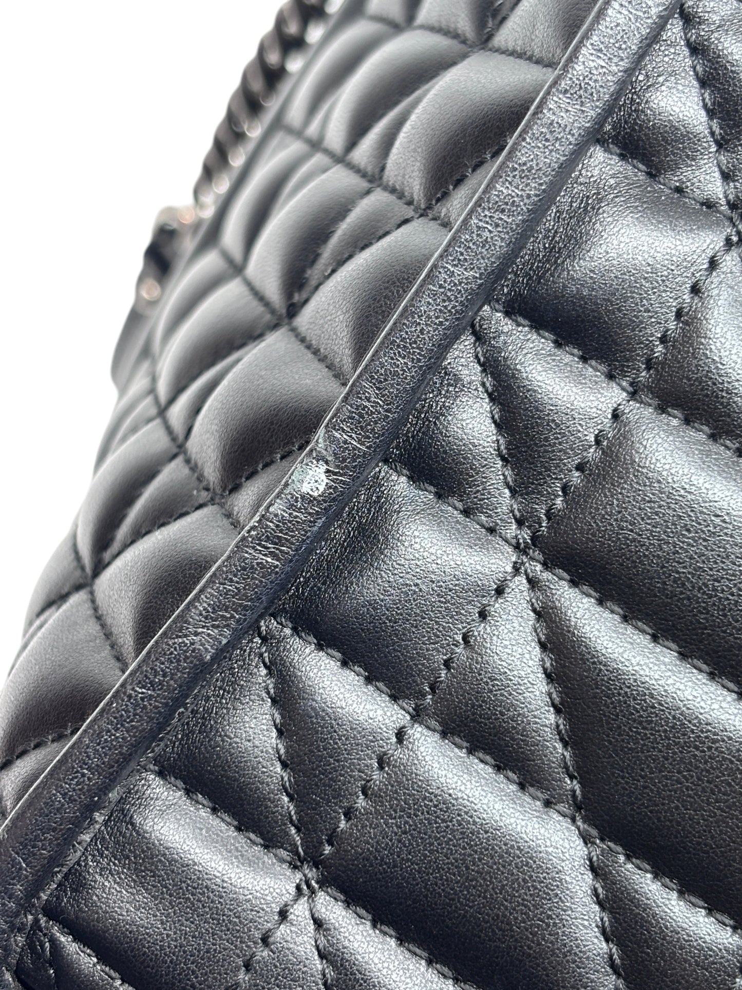 Posh Purse Co black matelassé leather Gucci GG Marmont bag showing chevron quilting and minor surface wear on strap