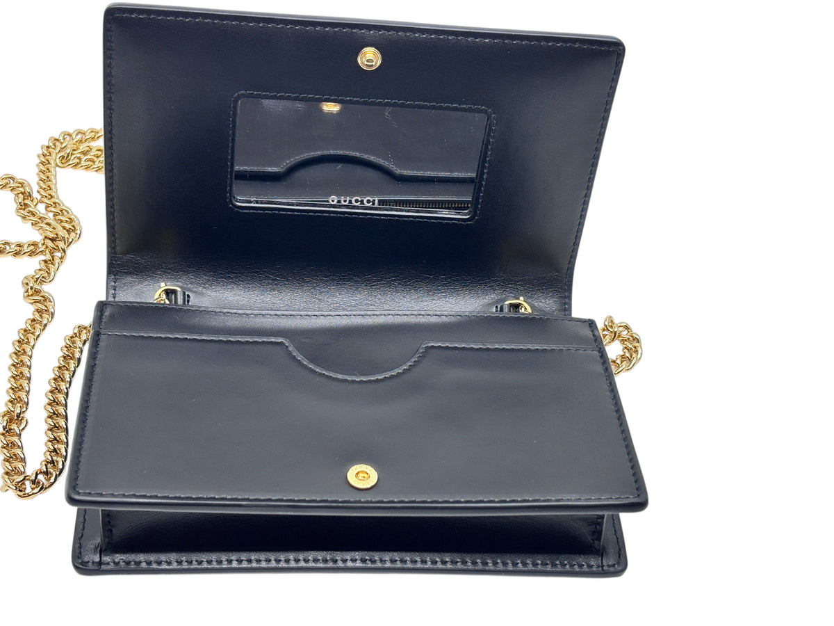 Posh Purse Co black Gucci GG Marmont wallet on chain interior view with gold chain strap and mirror on flap