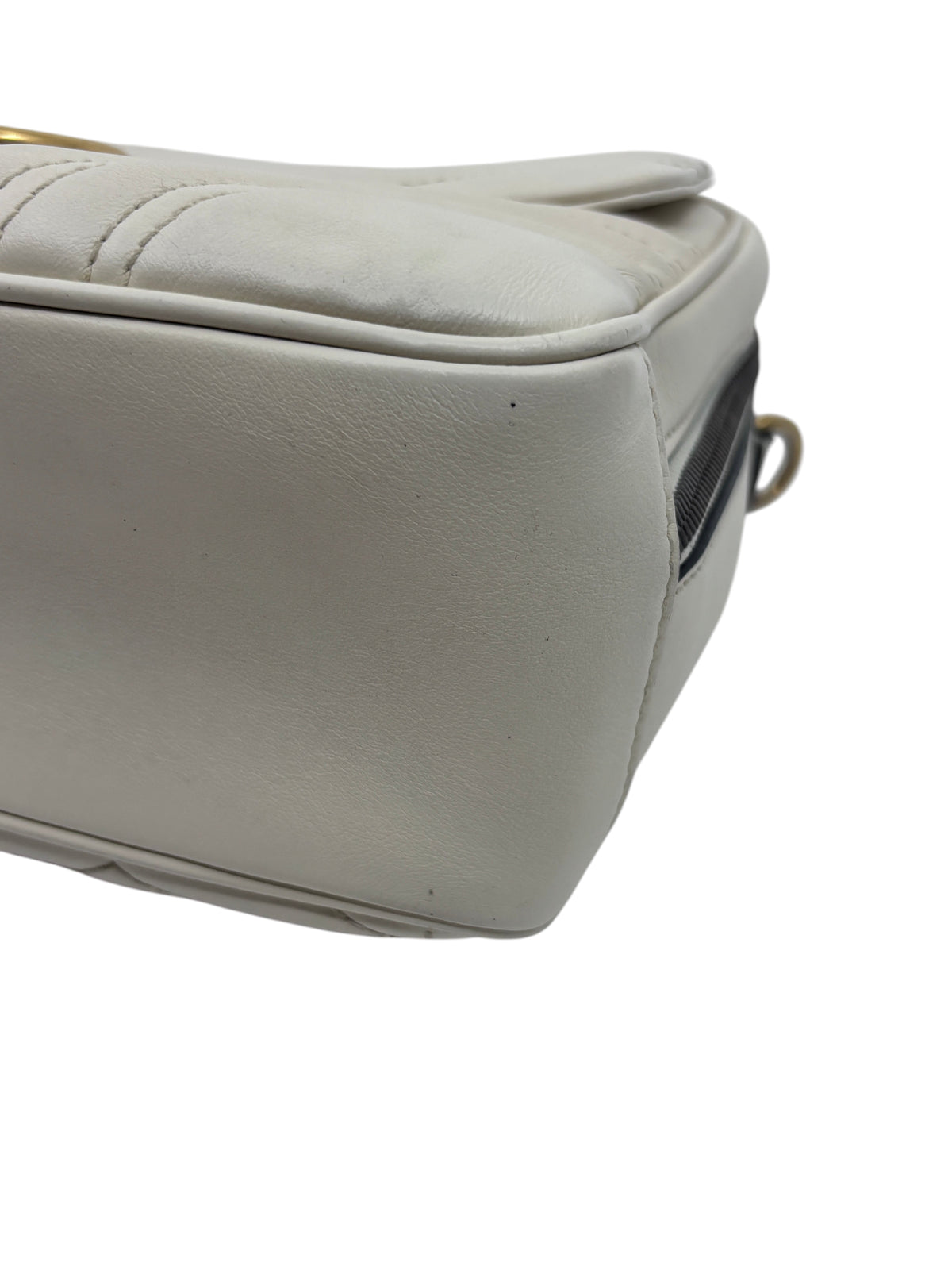 Posh Purse Co white leather Gucci GG Marmont bag side view showing quilted texture and smooth leather panel