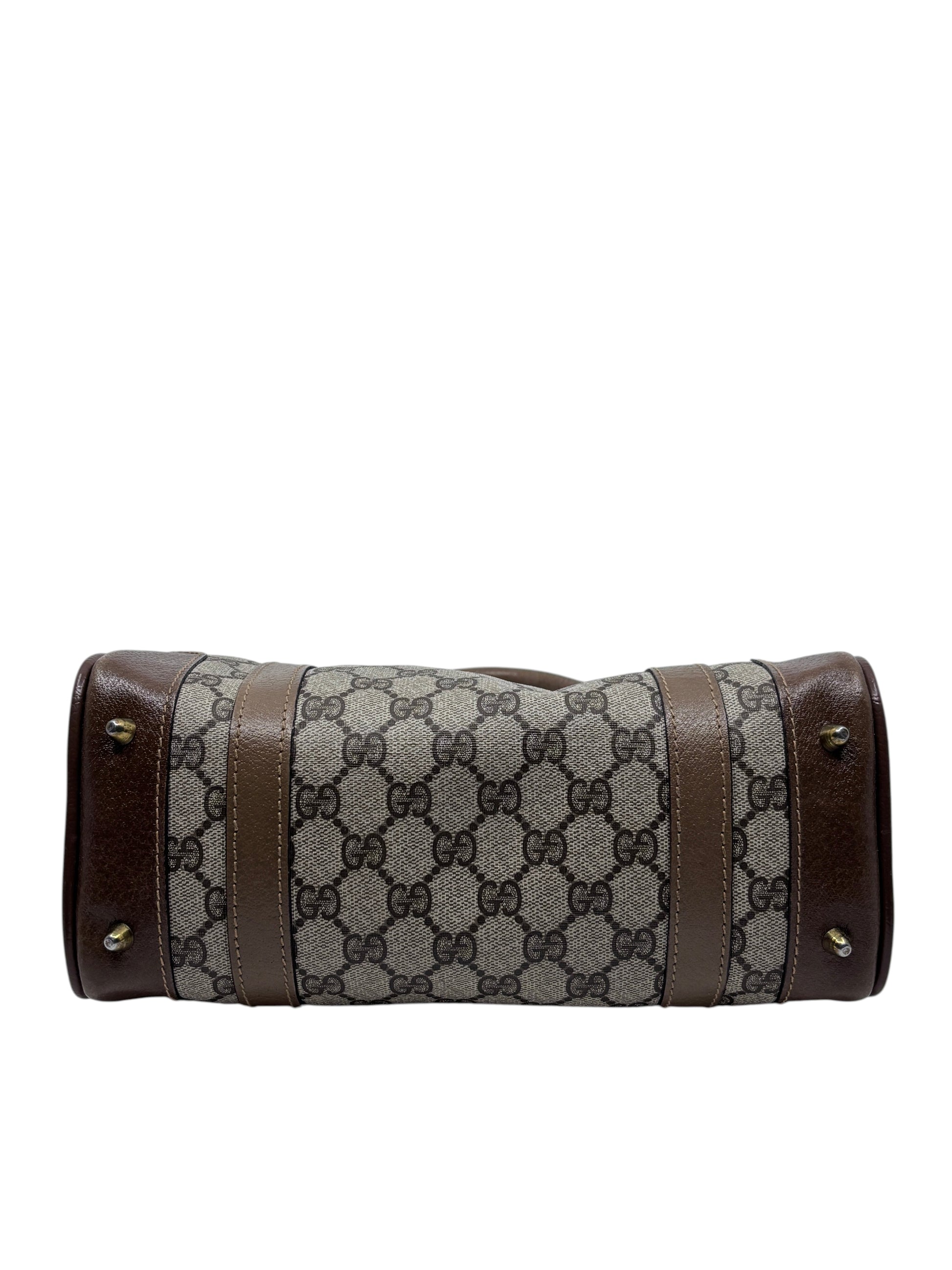 Posh Purse Co vintage Gucci Boston bag featuring the iconic GG monogram canvas with brown leather trim and metal feet.