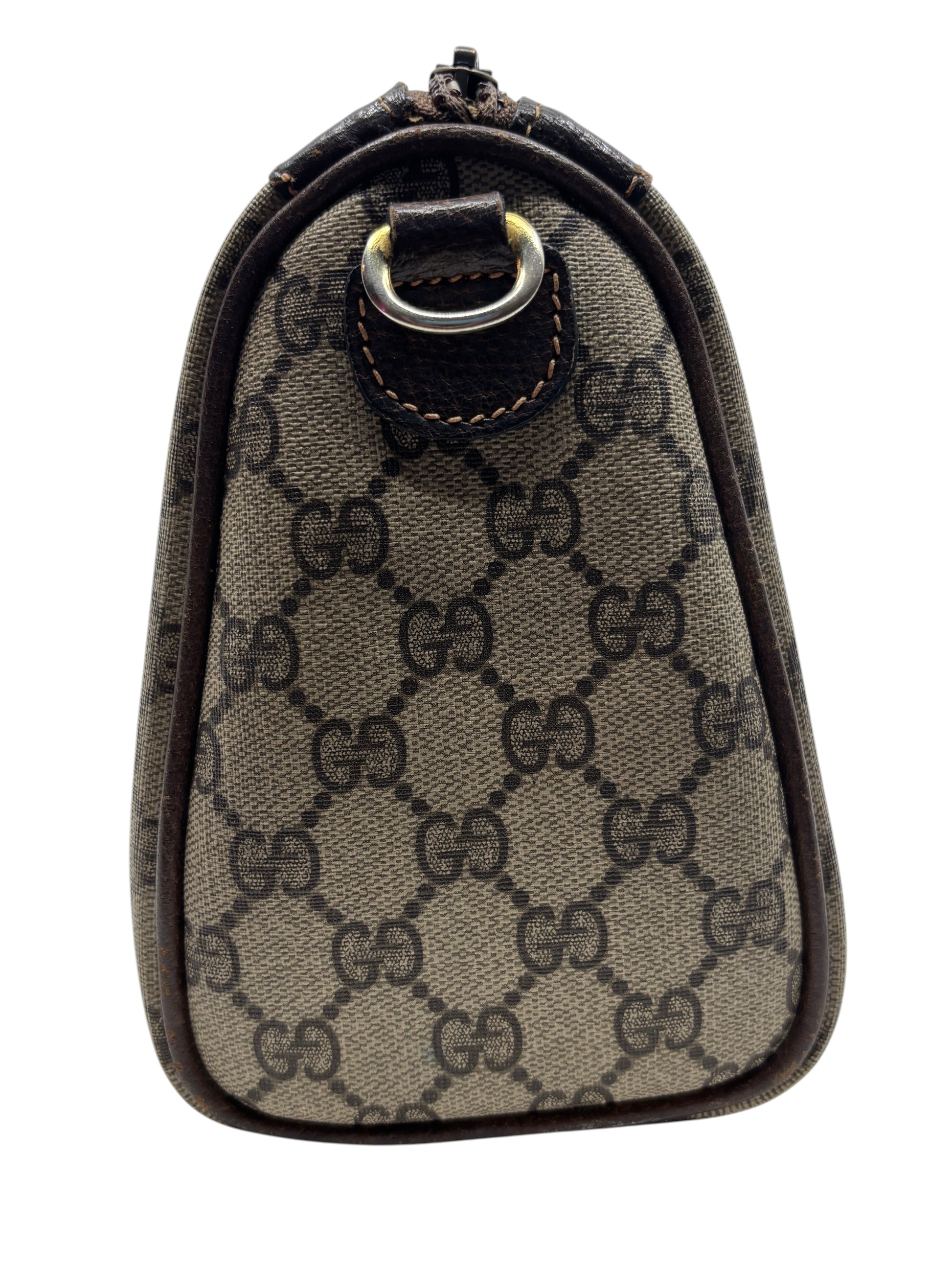 Side view of a vintage Posh Purse Co Gucci Boston bag featuring the iconic brown monogram canvas and leather trim.