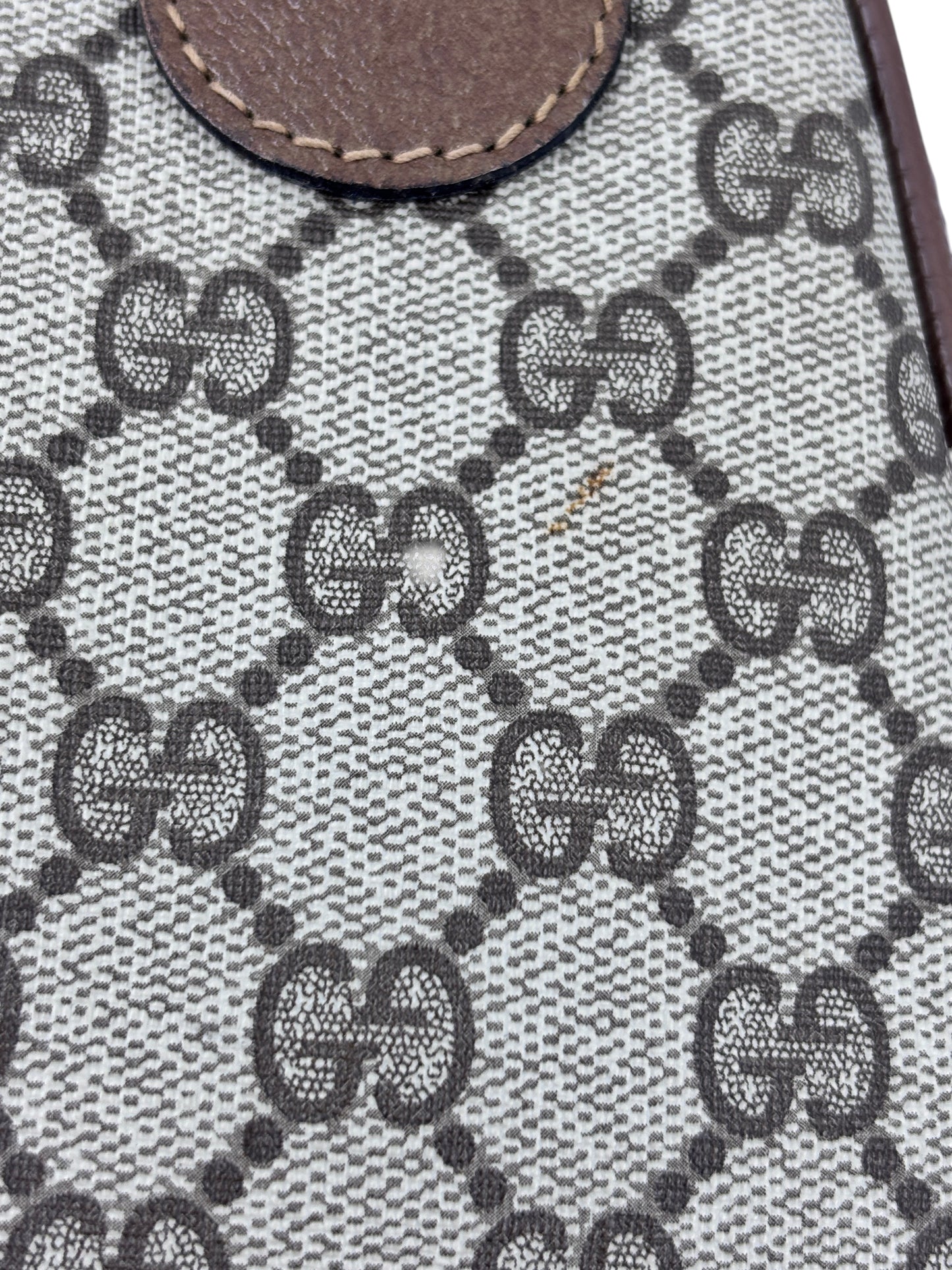 Close-up of the iconic beige and brown monogram canvas on a vintage Posh Purse Co Gucci Boston bag