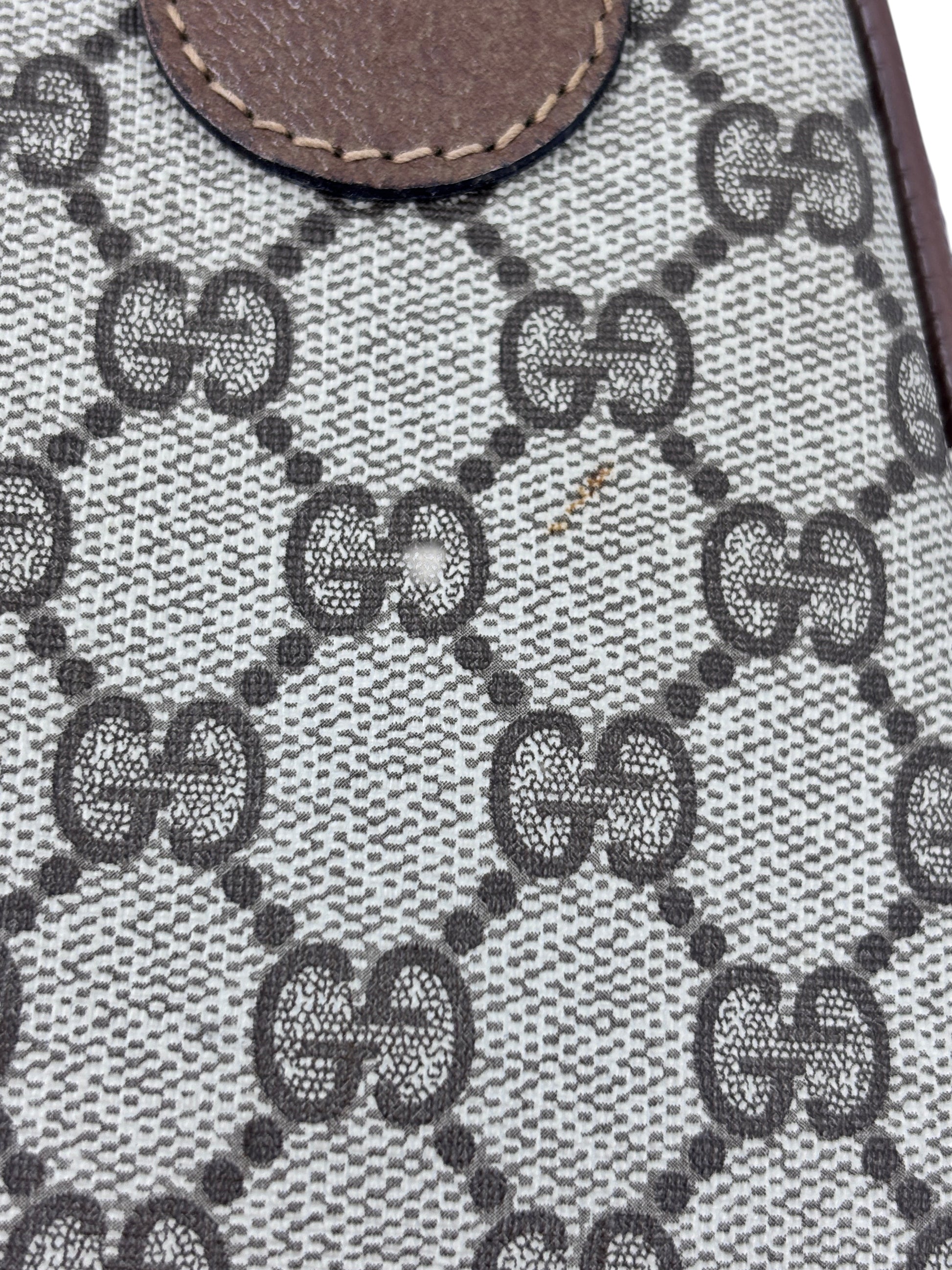 Close-up of the iconic beige and brown monogram canvas on a vintage Posh Purse Co Gucci Boston bag