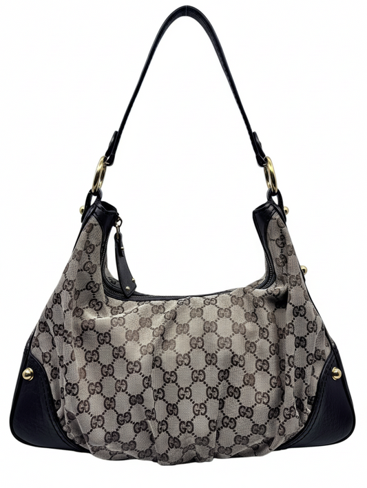 Posh Purse Co. preloved Gucci Jockey medium hobo bag in iconic GG monogram canvas with black leather trim and handle.
