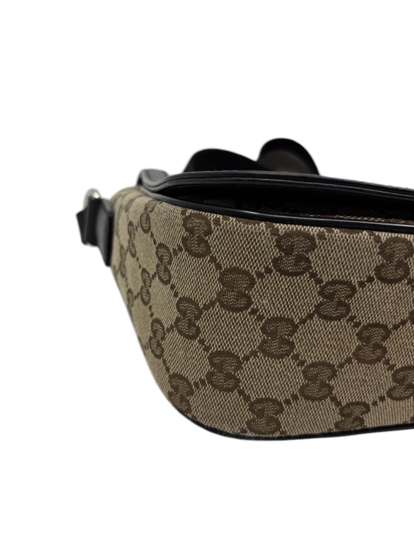 Posh Purse Co. preloved Gucci GG monogram canvas flap messenger bag in brown with black leather trim detail