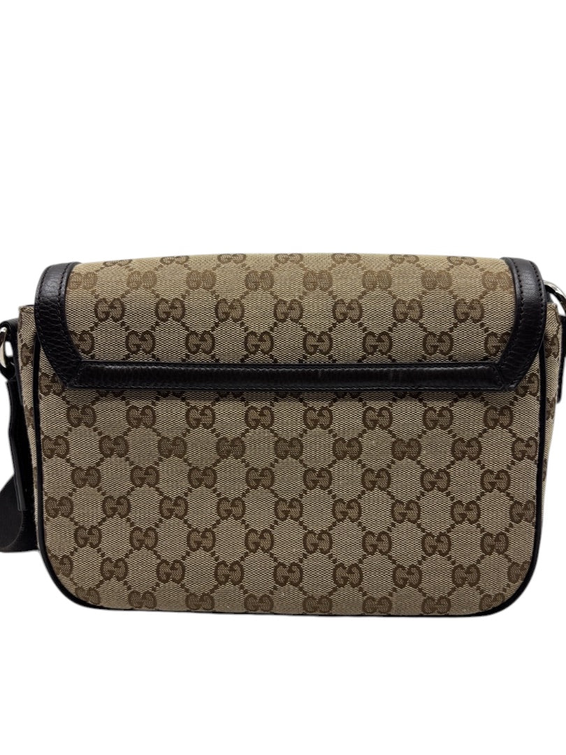 Posh Purse Co. preloved Gucci GG monogram canvas flap messenger bag in brown with black leather trim.