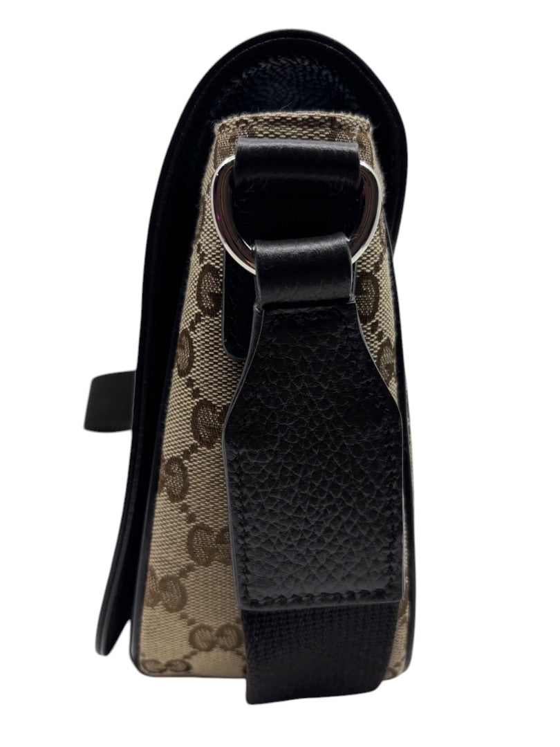 Posh Purse Co. Gucci GG monogram canvas flap messenger bag side view with black leather trim and silver hardware.