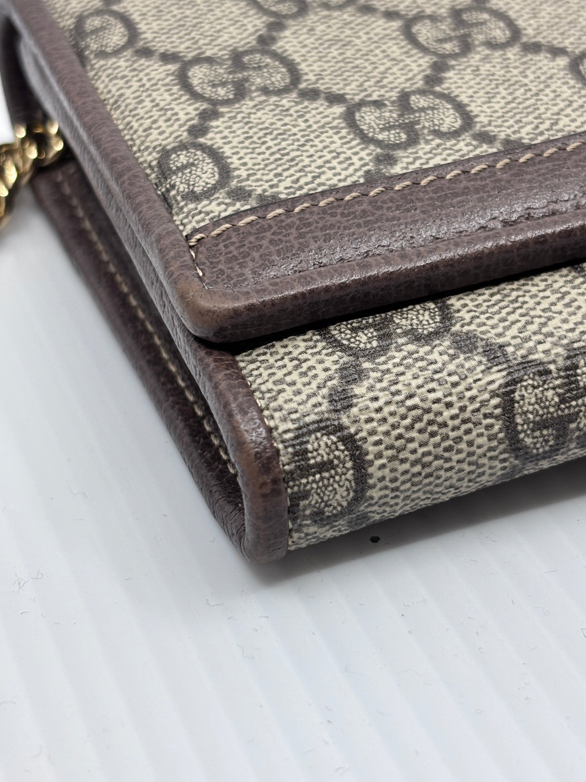 Posh Purse Co. preloved Gucci monogram canvas wallet on chain with brown leather trim and gold chain detail