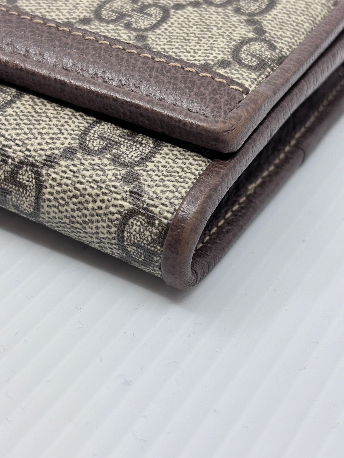 Posh Purse Co preloved Gucci monogram canvas wallet on chain with brown leather trim and classic GG pattern