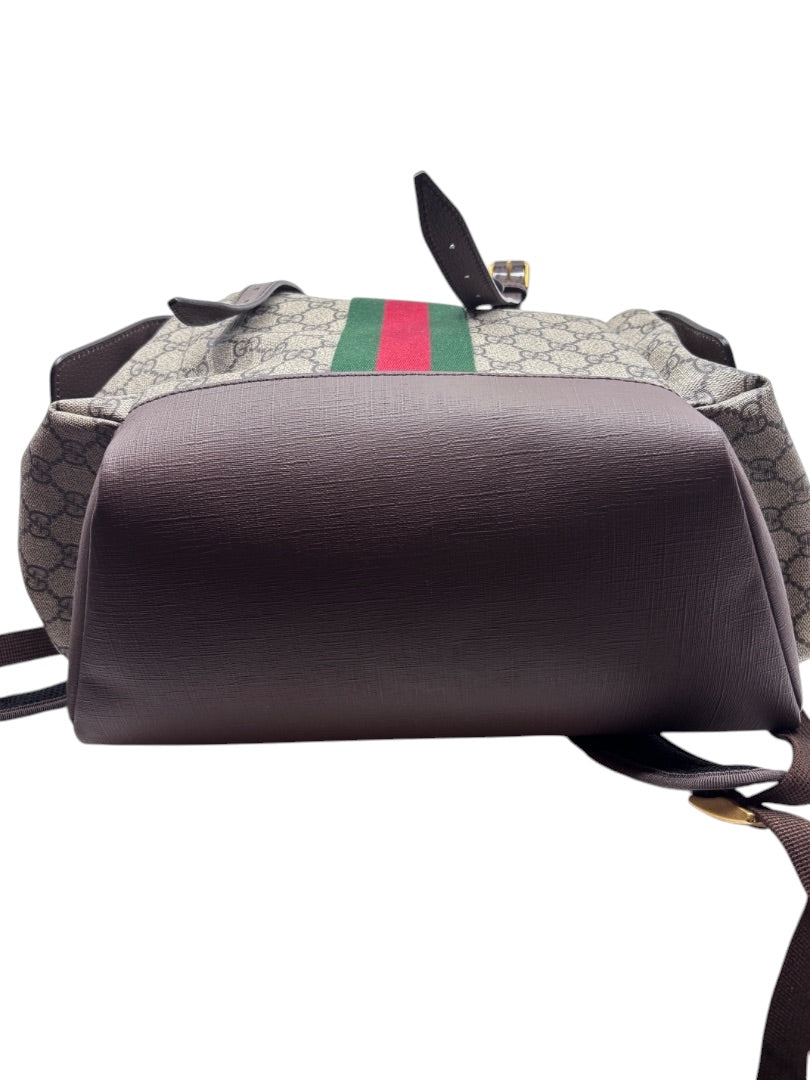 Posh Purse Co preloved Gucci GG Supreme Ophidia backpack showing the brown leather base and iconic web stripe detail