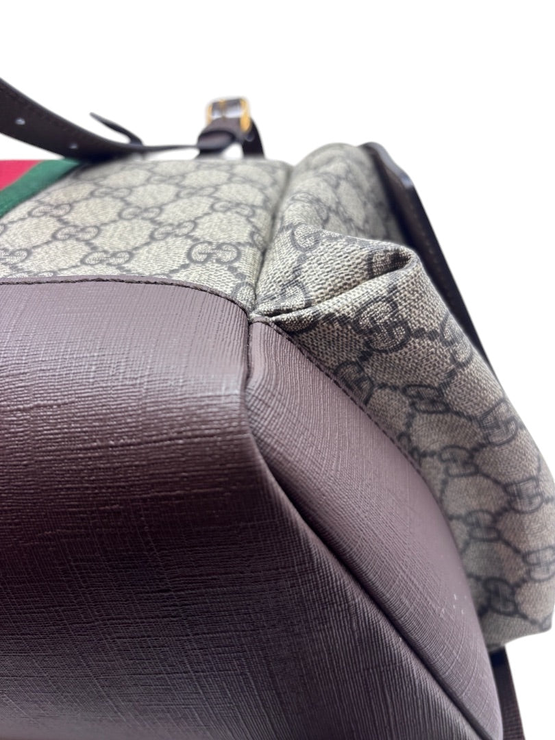 Posh Purse Co Gucci GG Supreme Ophidia backpack corner detail showing brown leather trim and monogram coated canvas