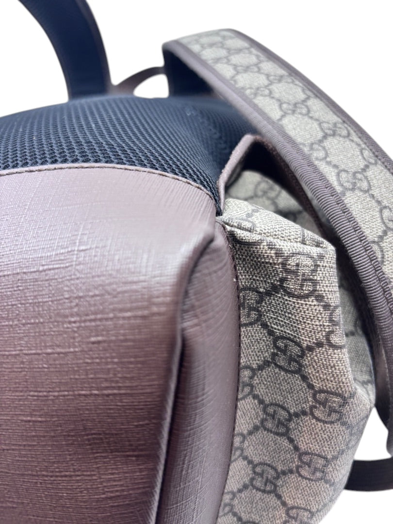 Posh Purse Co Gucci GG Supreme Ophidia backpack featuring monogram coated canvas, brown leather trim, and mesh back.