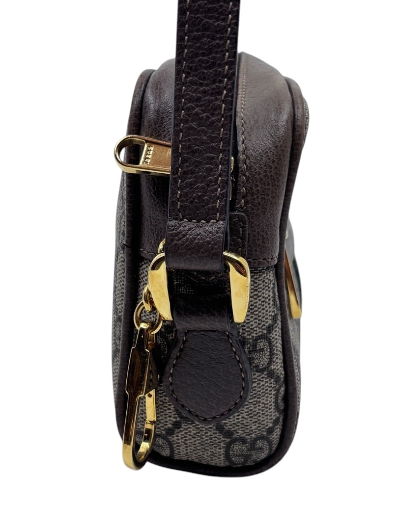 Posh Purse Co Gucci GG Ophidia shoulder bag side view showing monogram canvas, brown leather trim, and gold hardware.