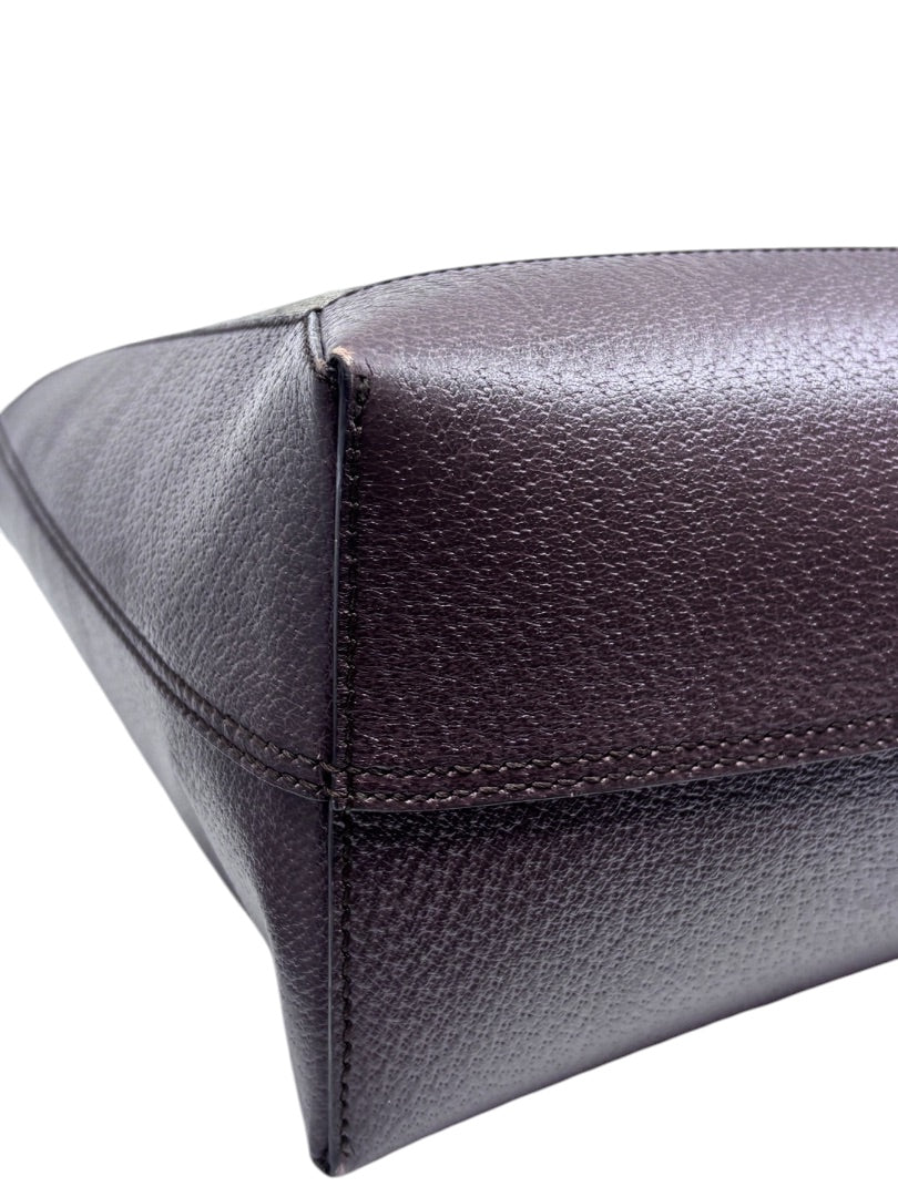 Close-up of the dark brown textured leather base corner of a Posh Purse Co. preloved Gucci Ophidia tote bag