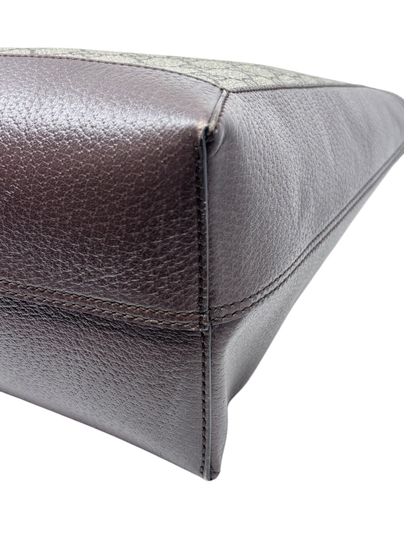 Close-up of the brown leather corner and GG Supreme canvas on a Posh Purse Co. Gucci Ophidia tote bag