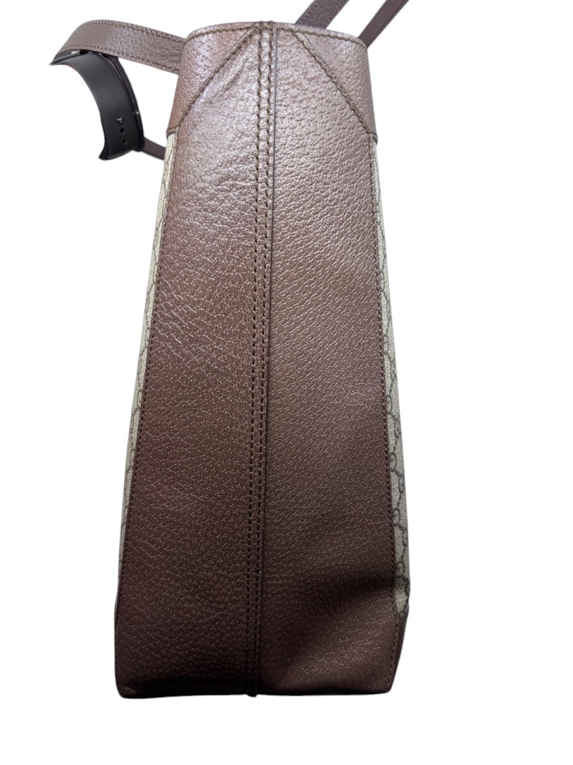 Side view of Posh Purse Co. preloved Gucci Ophidia large tote featuring brown textured leather and GG Supreme canvas