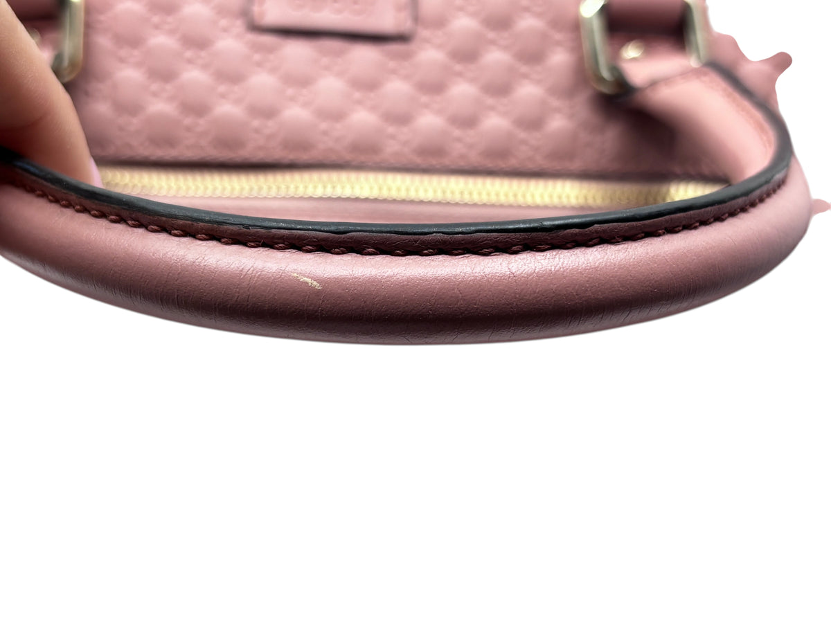 Posh Purse Co pink Gucci Micro Guccissima leather handbag handle showing minor scuffing and wear