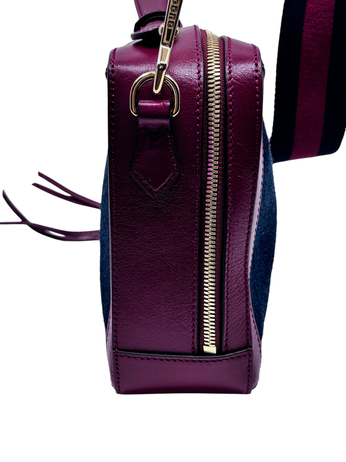 Side view of a Posh Purse Co preloved Gucci camera bag in red leather and blue suede with gold-tone hardware