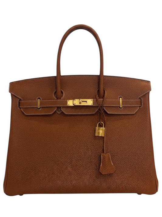 Posh Purse Co. Hermès Birkin 35 in gold Togo leather with iconic gold hardware and signature turn-lock closure.