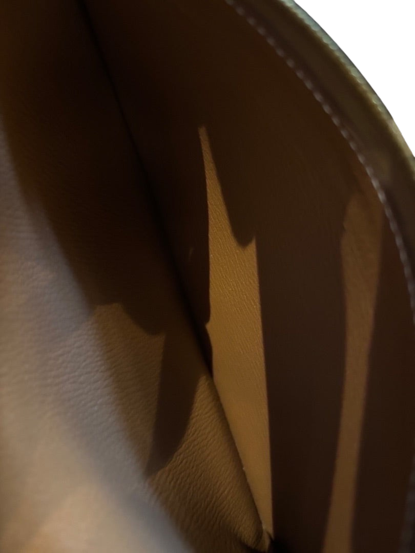 Interior of a Posh Purse Co. Hermès Birkin 35 bag in gold Togo leather showing the spacious leather-lined compartment.