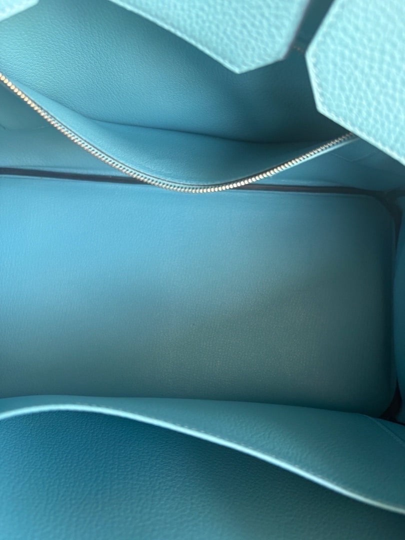 Interior view of a Posh Purse Co Hermès Birkin 35 in Bleu du Nord Togo leather with a clean, spacious compartment.