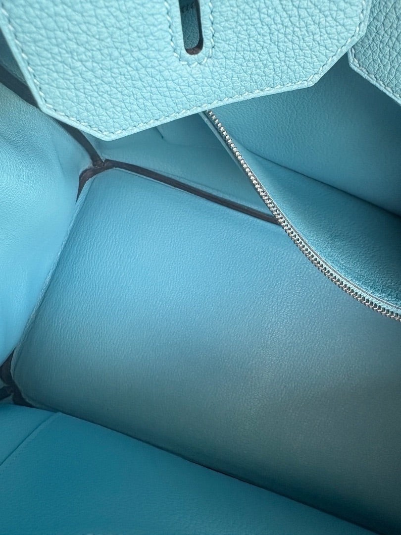 Interior view of a Posh Purse Co Hermès Birkin 35 in Bleu du Nord Togo leather with a silver zipper pocket