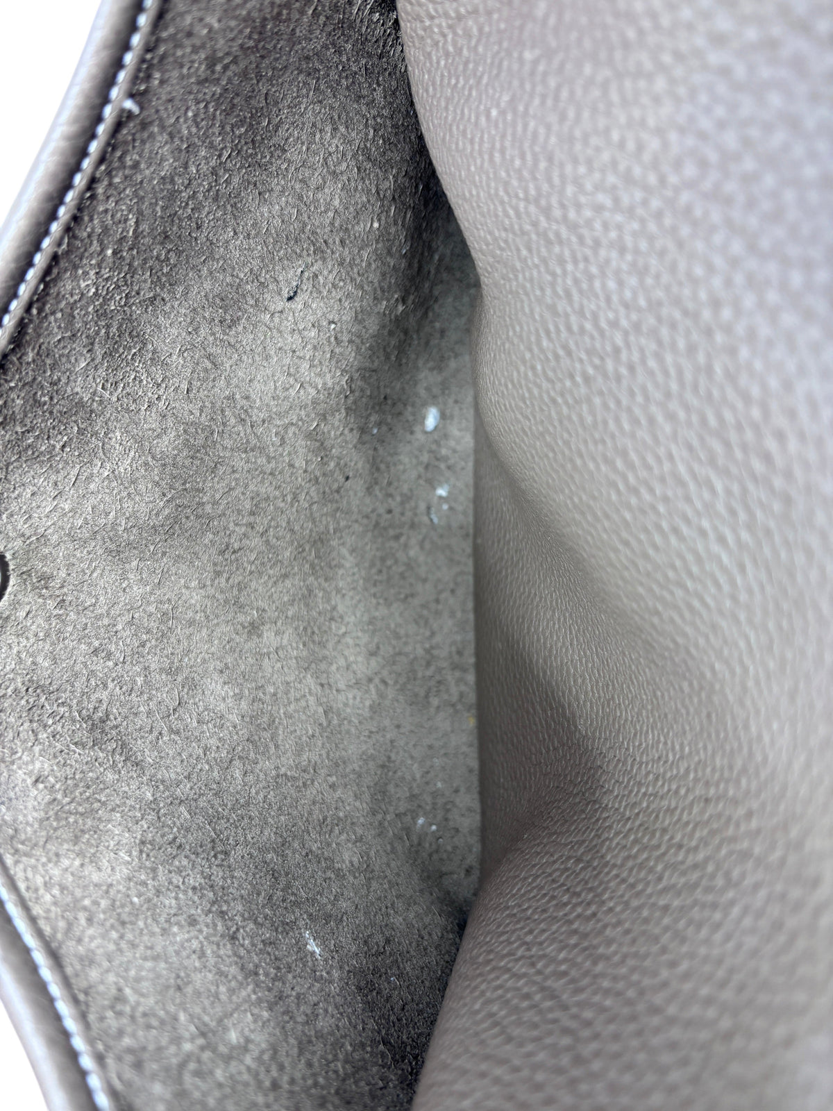 Interior view of a preloved Posh Purse Co. Hermès Evelyne PM bag showing the soft Taurillon Clemence leather lining.
