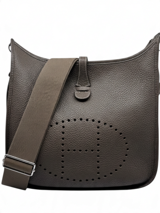 Posh Purse Co. preloved Hermès Evelyne PM bag in etoupe Taurillon Clemence leather with signature perforated H design.