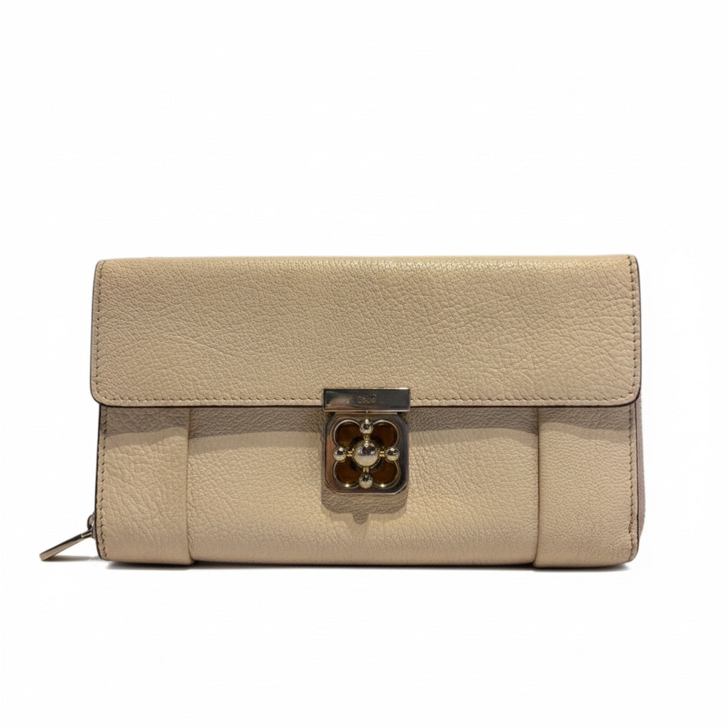 Posh Purse Co. ivory leather Chloé Elise wallet with silver clasp and organized interior.