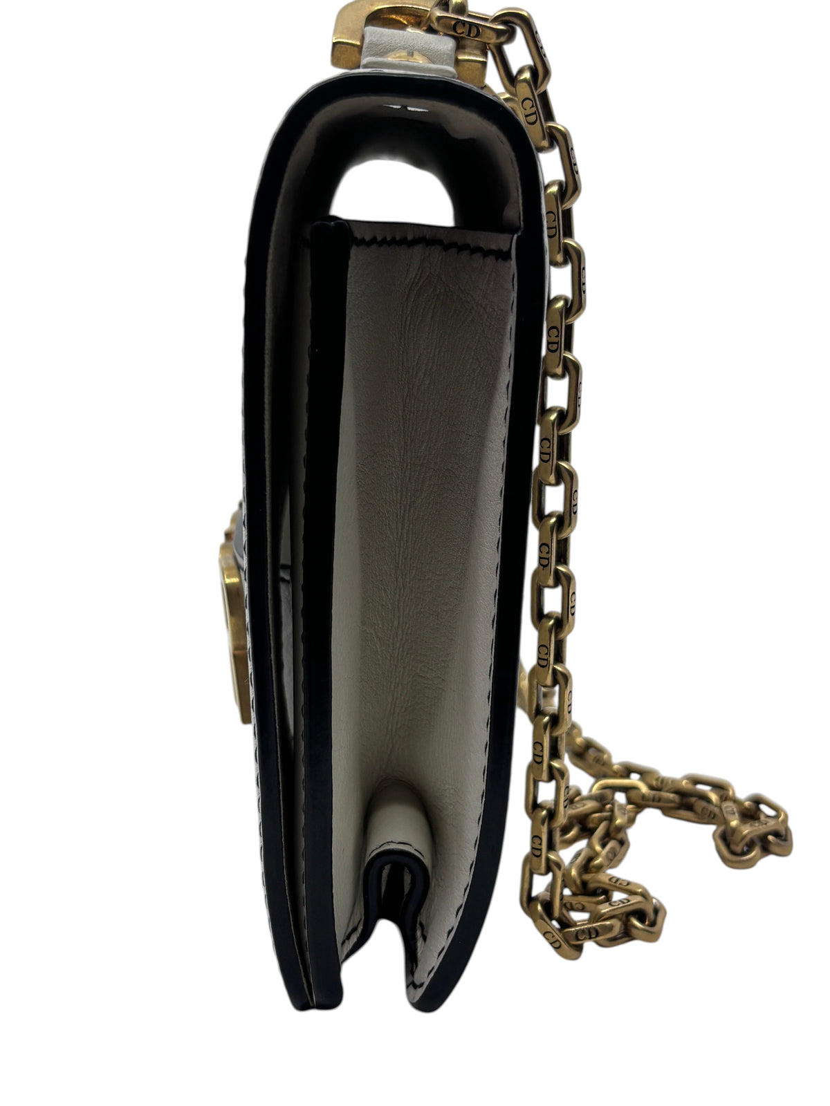Side view of Posh Purse Co ivory Dior J'adior chain flap bag showing the leather gusset and gold-tone chain strap