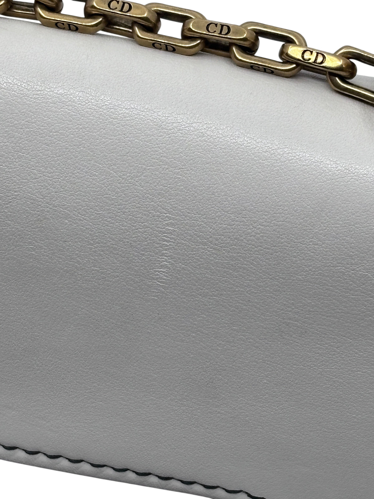 Posh Purse Co ivory Dior J'adior chain flap bag featuring antique gold-tone CD logo chain strap and leather texture.