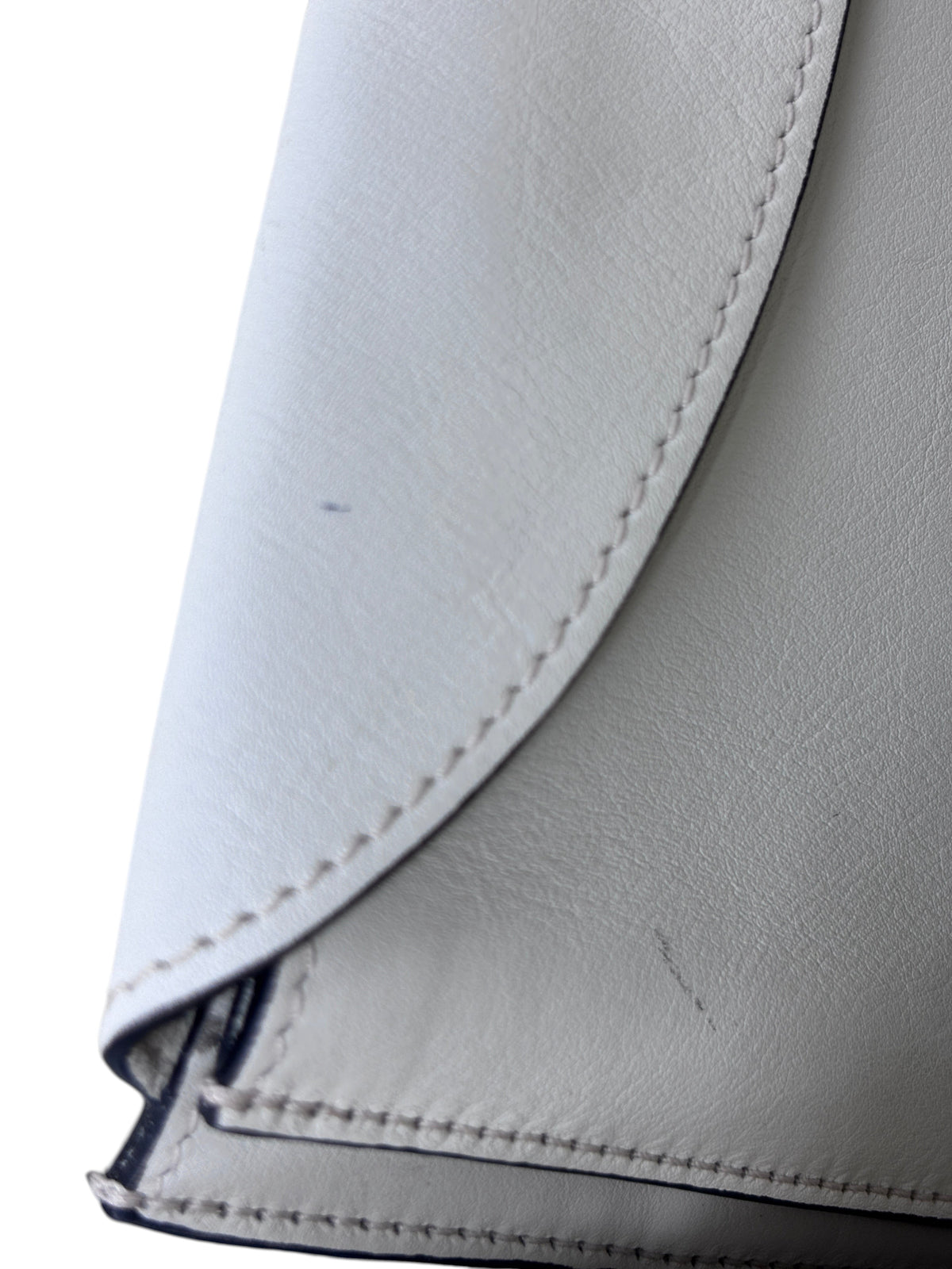 Close-up of ivory leather on a Posh Purse Co Dior J'adior bag showing minor surface scratches and stitching detail.
