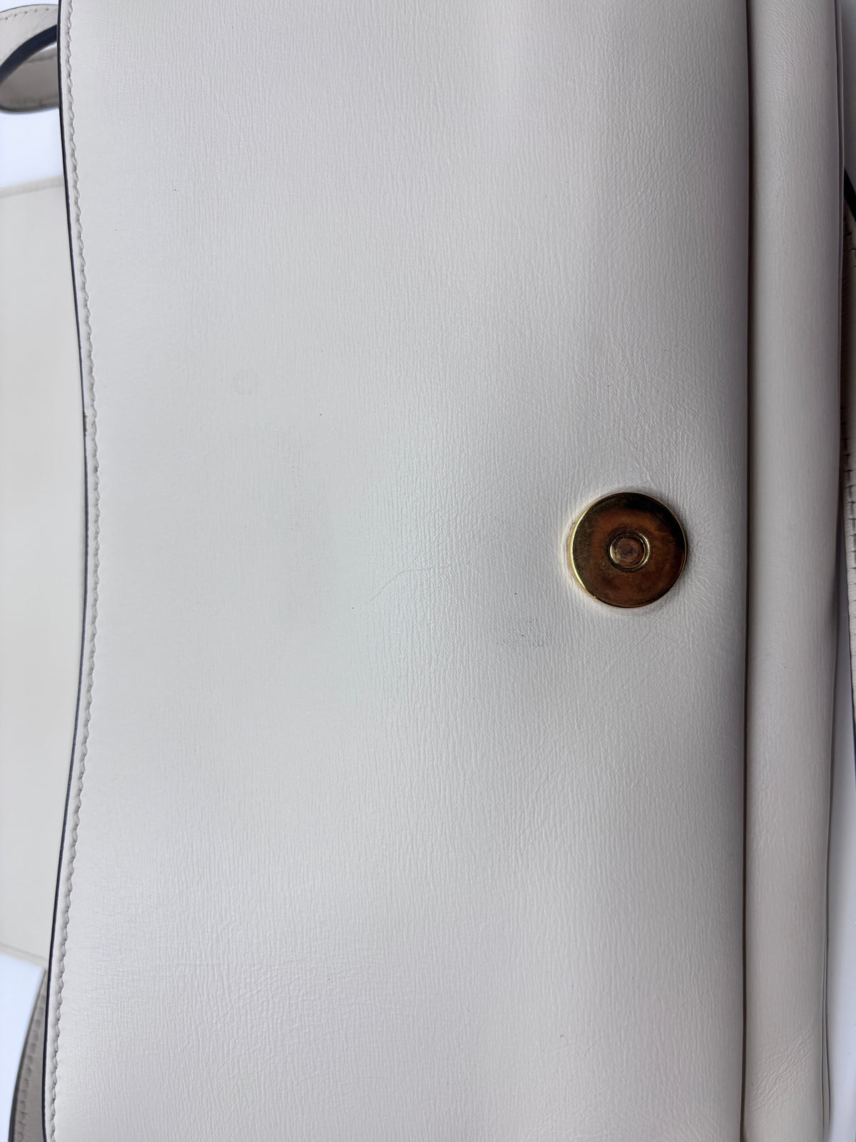 Posh Purse Co ivory Gucci Arli handbag featuring smooth leather and a gold-tone magnetic snap closure detail