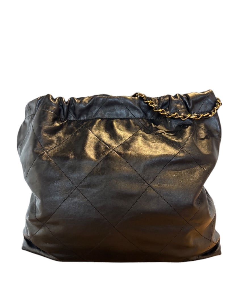 Posh Purse Co. Large black Chanel 22 bag in shiny calfskin leather with gold hardware and diamond quilting.